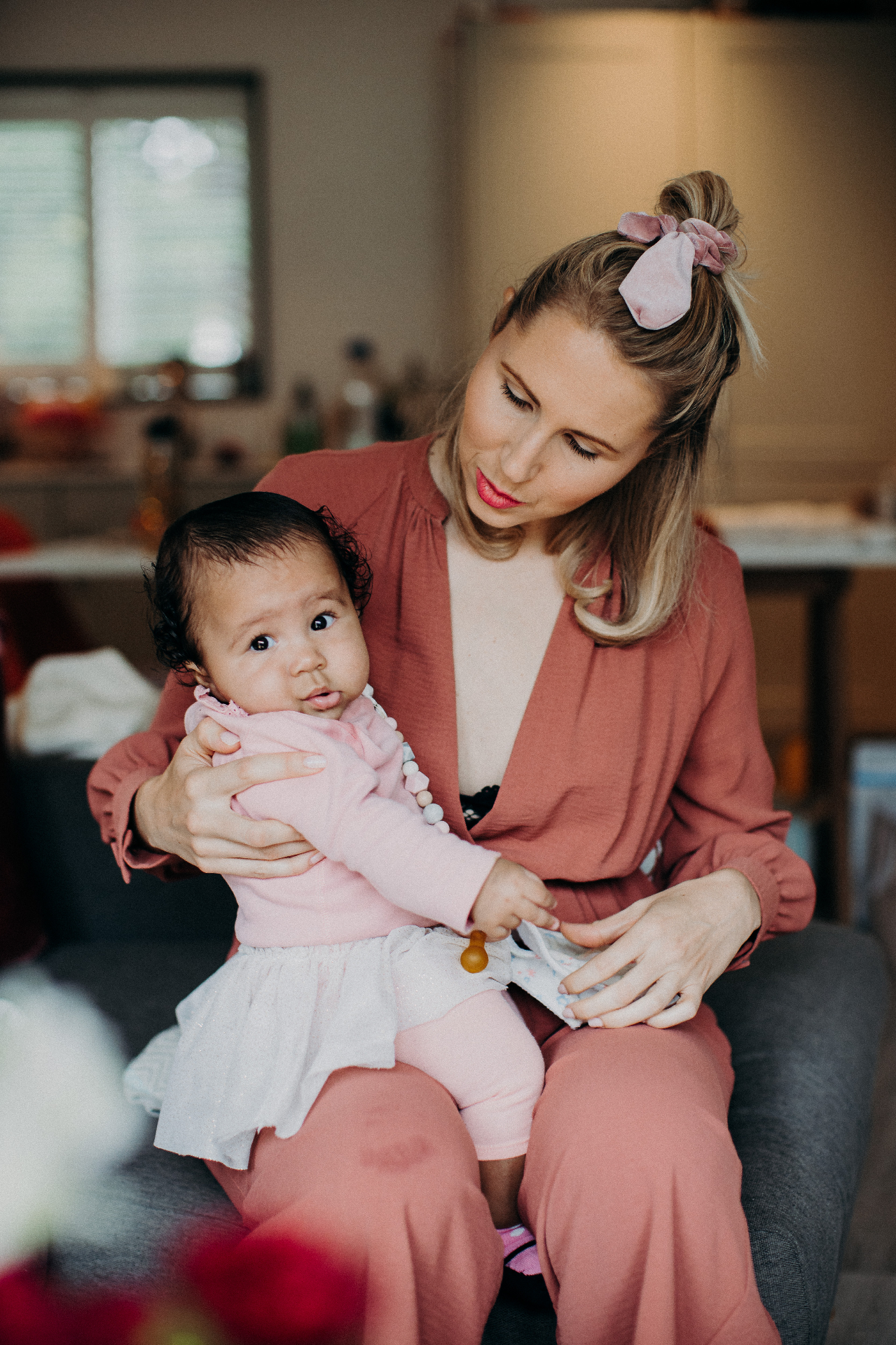 A parent holding her child